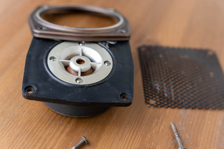 disassembled speaker parts, focusing on the circuit board, wires, and components, showing the inner workings of the speaker system. Detailed view of electronic elements and wiring.の写真素材