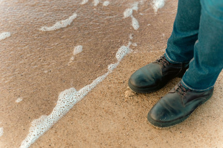 a girl walks on an autumn deserted beach.