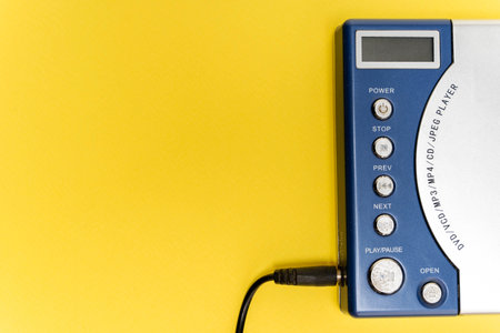 vintage DVD player. An electronic device. bright yellow background.の写真素材