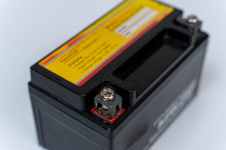 A motorcycle battery displayed on a clean white surfaceの写真素材