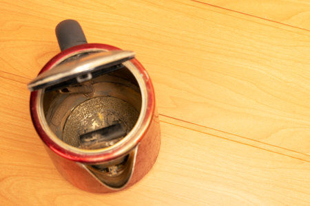 broken old used electric kettle with scale and lime depositsの写真素材