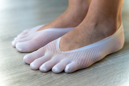 White toe socks on a wooden floor