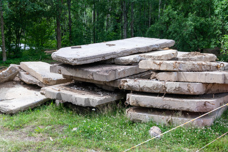 Discarded concrete slabs in a forest clearingの写真素材