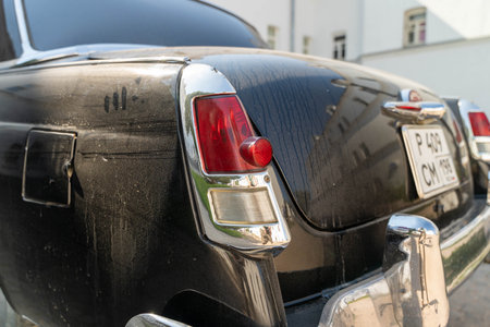 Russia, Valaam Island, July 27, 2024 - GAZ 21, Volga, vintage black car rests quietly outside a buildingのeditorial素材