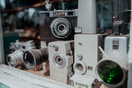 Pskov Region, Russia , July 21, 2024 - Vintage cameras showcased beautifully in a unique storefront, Shift 8, Quartzのeditorial素材