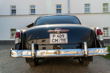 Russia, Valaam Island, July 27, 2024 - GAZ 21, Volga, vintage car stands parked in front of a historic buildingのeditorial素材