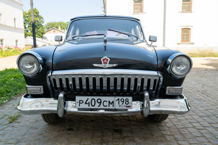 Russia, Valaam Island, July 27, 2024 - GAZ 21, Volga, vintage car stands prominently on the cobbled streetのeditorial素材