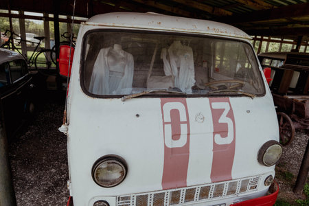 Pskov Region, Russia , July 21, 2024 - ErAZ 762 Ambulance Van, old van parked in a shelter with a weathered exteriorのeditorial素材