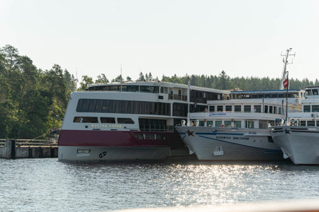 Russia, St. Petersburg, July 27, 2024 - Boats are gathered closely together at a quiet marinaのeditorial素材