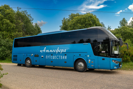 Pskov Region, Russia , July 20, 2024 - travel bus is parked beside a winding road in natureのeditorial素材