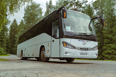 Pskov Region, Russia , July 20, 2024 - bus rests on a country road under a cloudy skyのeditorial素材