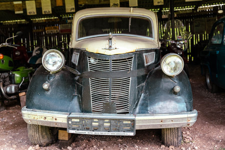 Pskov Region, Russia , July 21, 2024 - vintage car sits proudly in a rustic garage, showcasing characterのeditorial素材
