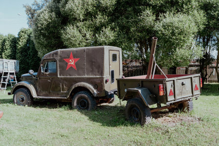 Pskov Region, Russia , July 21, 2024 - Classic Soviet truck and attached trailer resting on the lawn, GAZ 69のeditorial素材