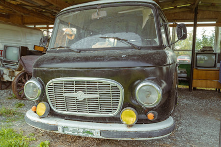Pskov Region, Russia , July 21, 2024 - barkas b1000, classic delivery van resting in a rustic barn settingのeditorial素材
