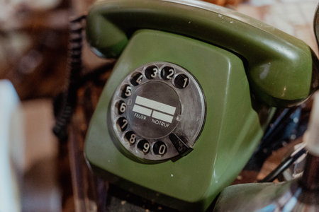Pskov Region, Russia , July 21, 2024 - classic rotary telephone with an olive green design sits quietlyのeditorial素材