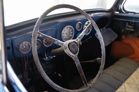 Pskov Region, Russia , July 21, 2024 - rustic steering wheel and dashboard showcase automotive nostalgiaのeditorial素材