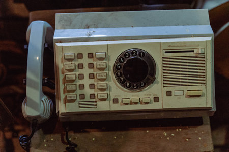 Pskov Region, Russia , July 21, 2024 - vintage rotary phone and buttons are covered in dustのeditorial素材