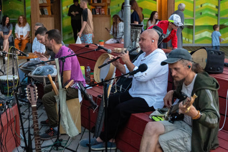 Russia, Sosnovy Bor, September 7, 2024 - musicians plays various instruments at a lively outdoor festivalのeditorial素材