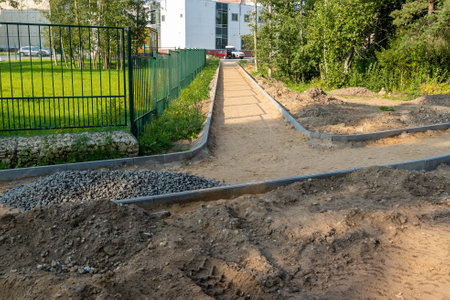 A construction site shows a pathway being built with gravel and sand.の写真素材