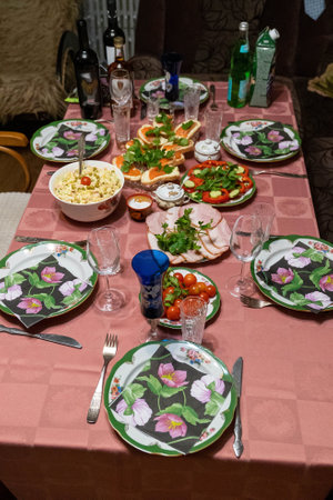 Festive table setting with traditional dishes and drinks for a celebrationの写真素材
