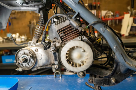 Close-up of motorcycle engine undergoing maintenance in professional workshopの写真素材