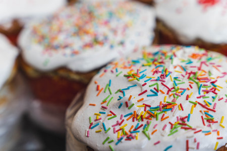 Delicious cupcakes topped with vibrant sprinkles ready for enjoyment.の写真素材