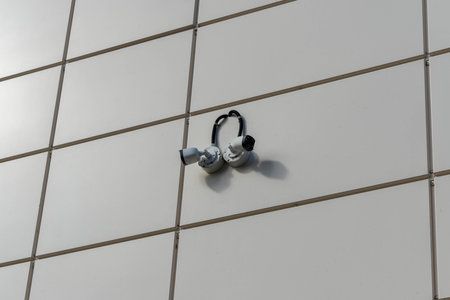 Security cameras observing building facade ensuring safety and surveillance