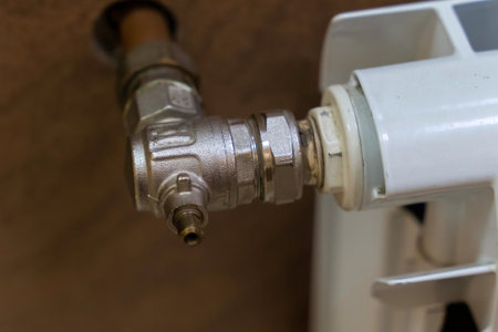 Plumbing fixture connecting radiator to home heating systemの写真素材