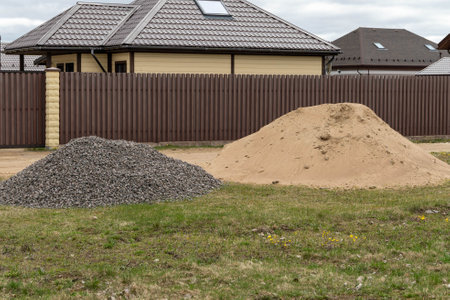 Construction materials sand and gravel preparing a foundation for building a houseの写真素材