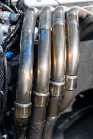 Exhaust manifold pipes showing oxidation after use in racing carの写真素材