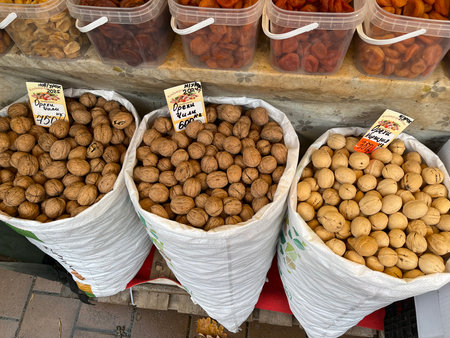 Russia, Sosnovy Bor, October 12, 2025 -Nuts in white sacks displayed at a market in Sosnovy Bor, Russiaのeditorial素材