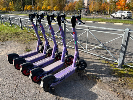 Russia, Sosnovy Bor, October 12, 2025 -Several electric scooters parked near the roadside in Sosnovy Borのeditorial素材