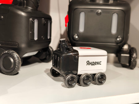 Russia, St. Petersburg, March 14, 2026 -Yandex robot standing on display with other robots in a tech...