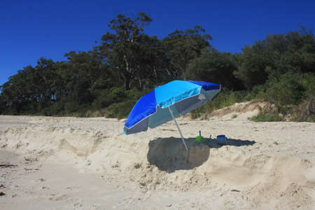 Lonely Umbrella on the Beachの写真素材