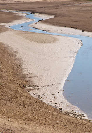 Rest of the Water on bottom of the dried lakeの写真素材