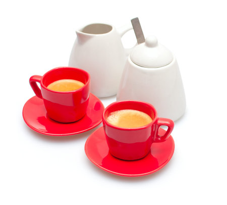 Espresso Coffee in Red Mugs, Cream Pot and Sugar Basin on White Backgroundの写真素材