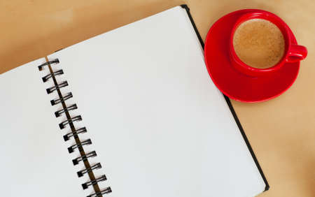 Espresso Coffee and Blank Paper Notebook on Wooden Tableの写真素材