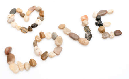 Love Sign Made of Pebbles on White Backgroundの写真素材
