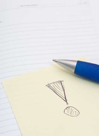 Empty Notebook, Ballpoint and Yellow Memo Stick With Exclamation Mark on White Backgroundの写真素材