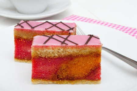 Punch Cake - Sweet Dessert on White Plate on Tableの写真素材
