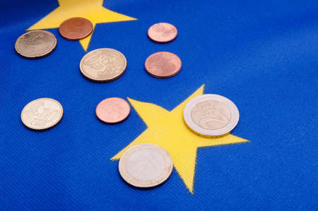 Euro Coins on Blue Flag of European Unionの写真素材