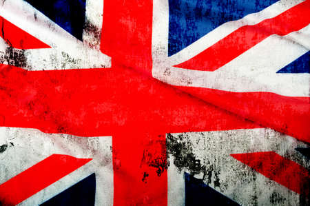 Closeup of Grungy Flag of Great Britain - UK Flag Draperyの写真素材