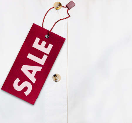 Red Sale Sign on White Shirt - With Copyspaceの写真素材