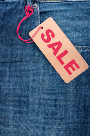 Closeup of Blue Jeans With Brown Sale Tagの写真素材