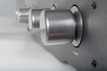 Volume Knob on Silver Metallic Amplifier - Shallow Depth of Field