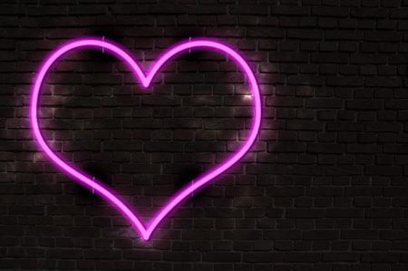 Glowing Neon Heart on Old Brick Wallの写真素材