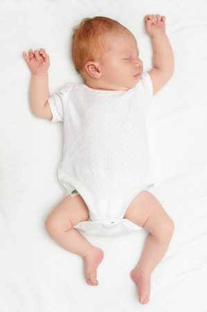 Sleeping Newborn Baby on White Bed Sheet