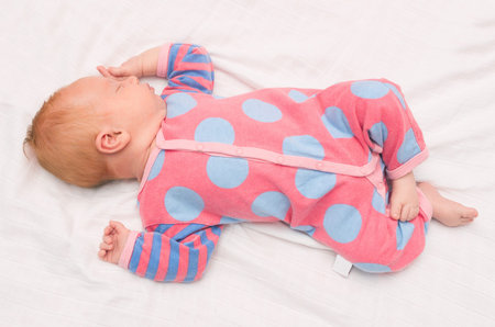 Newborn Baby Sleeping on White Blanket