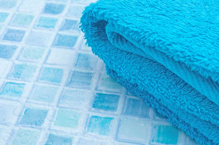 Blue Bath Towels on Blue Bathroom Tilesの写真素材