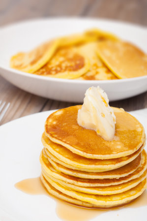 Homemade Pancakes With Butter and Warm Maple Syrup - Shallow Depth of Fieldの写真素材